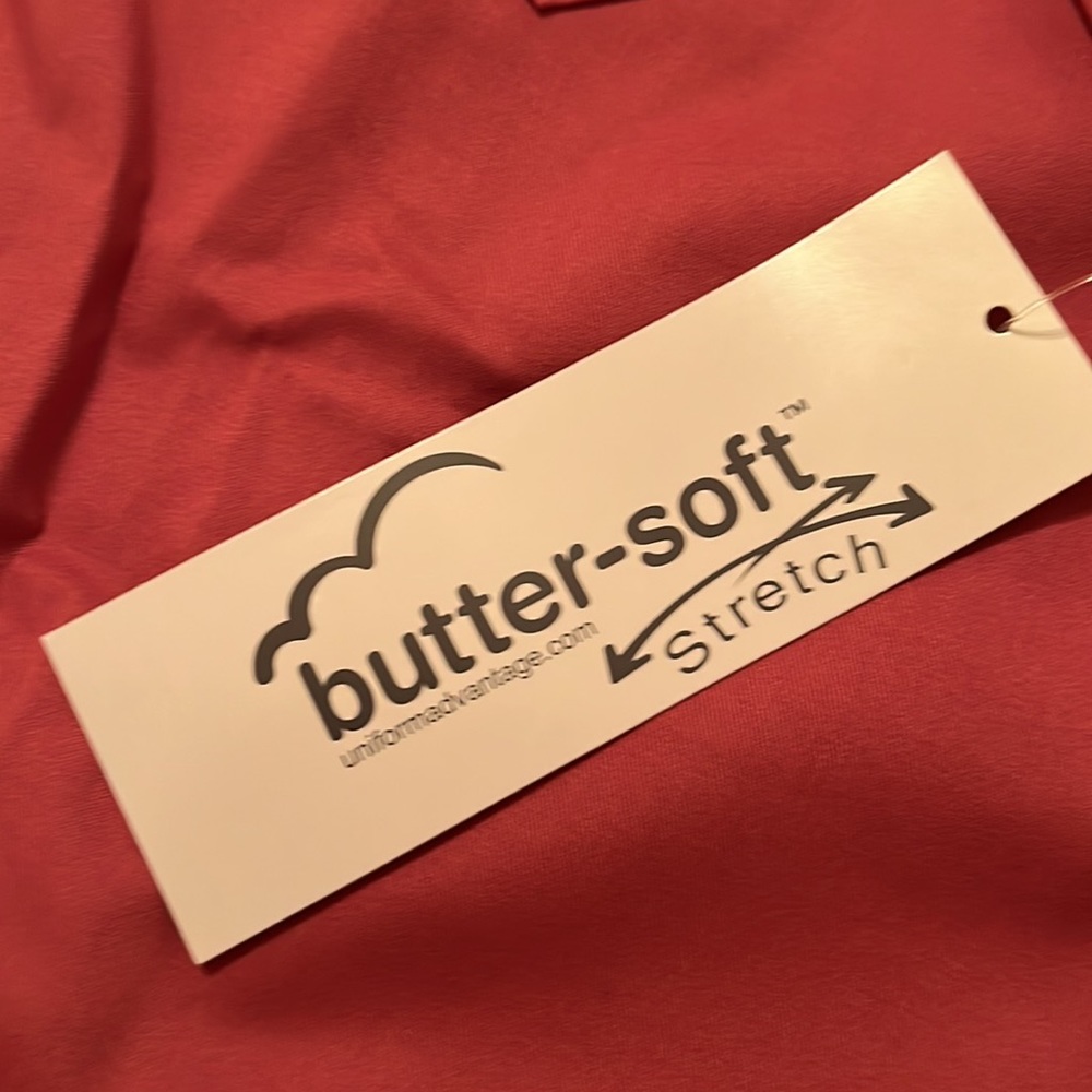 Scrub top. Lots of details. Never worn - Picture 2 of 6